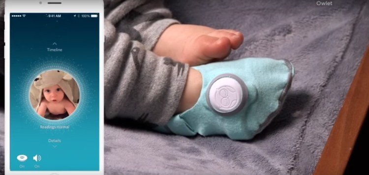The sock monitor on the baby's foot.