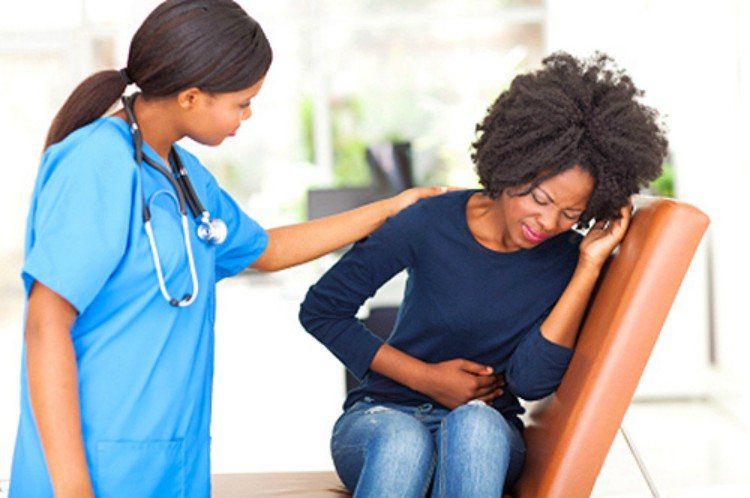 doctor treats woman with stomachache