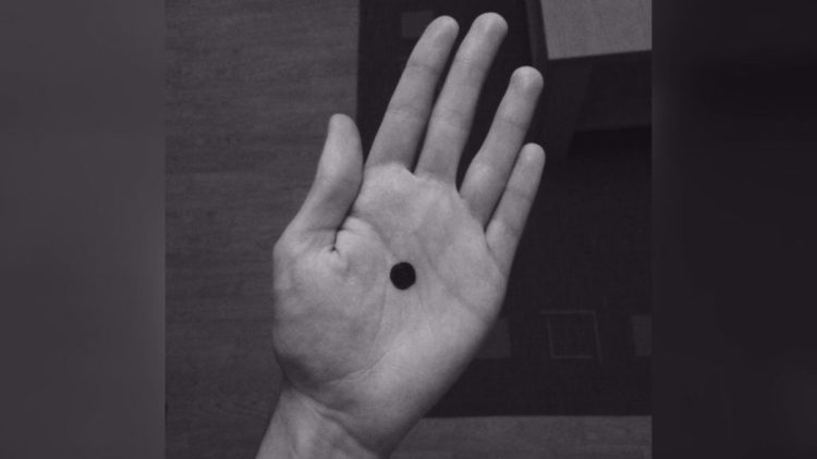 Black dot in a black and white picture.