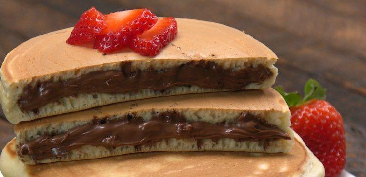 Close-up of 2 Nutella-Stuffed Pancakes sliced in half