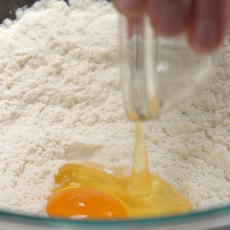 Mix egg and flour to start pancake batter mix