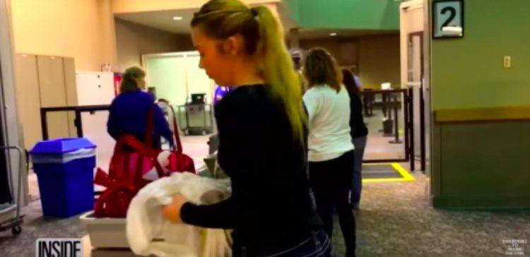 Mackenzie goes through airport security