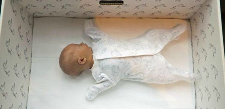 Baby sleeping in a "baby box".