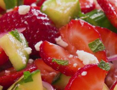 Fresh and easy summer salad with ripe strawberries, cucumbers, mint, red onions, and feta cheese tossed with a delicious homemade honey lemon salad dressing.