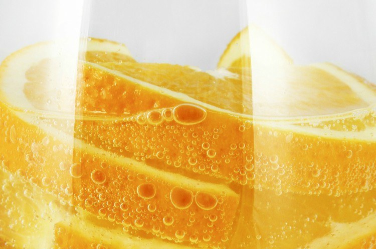 Image of orange slices in water.