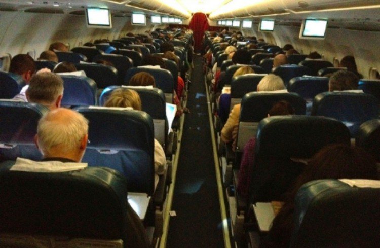 cabin view of crowded airplane