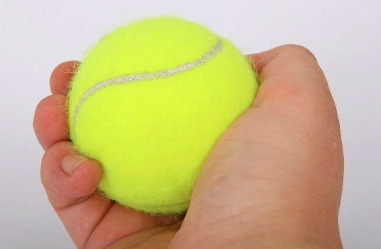 tennis ball hand
