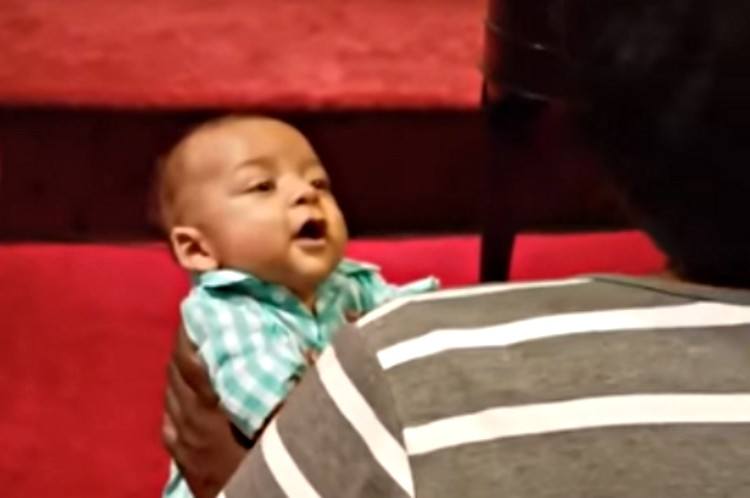 Baby listens to mom singing.
