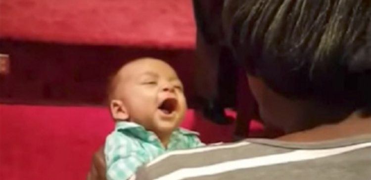 Baby singing with mom.