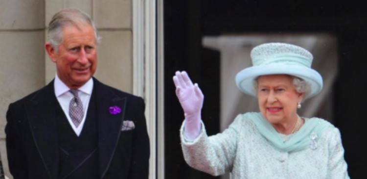 Queen Elizabeth waves next to Prince Charles