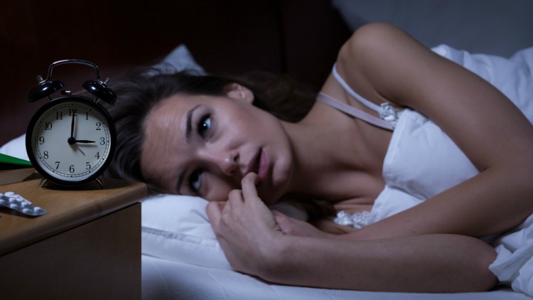 Woman lying in bed sleepless