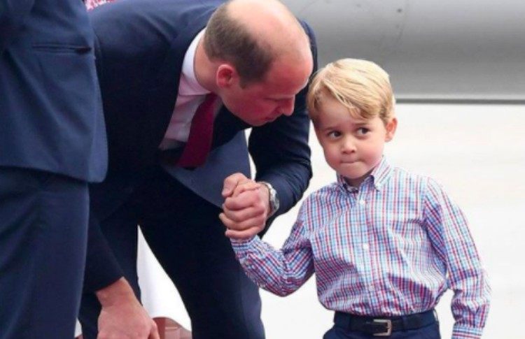 Prince William talks to Prince George