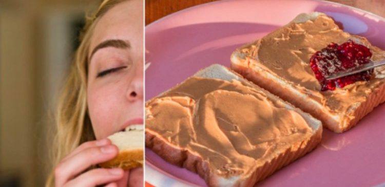 woman eating peanut butter with peanut butter on bread