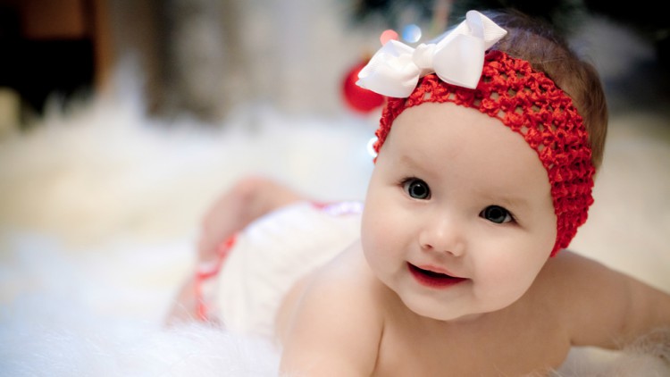 Baby with bow on its head