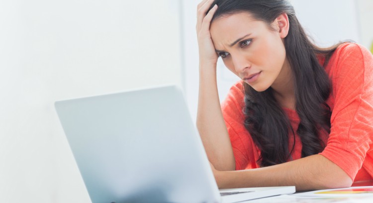 Frustrated woman at computer
