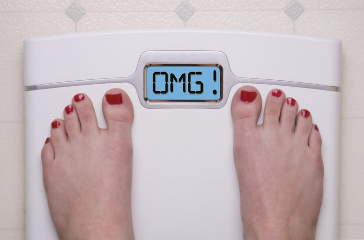 Image of digital bathroom scale displaying OMG message