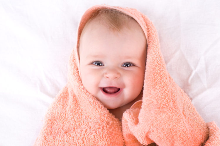Image of a cute baby wrapped in a towel.