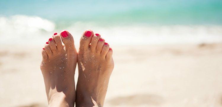 Pic of feet in the sand.