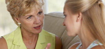 Image of woman scolding teenage girl.