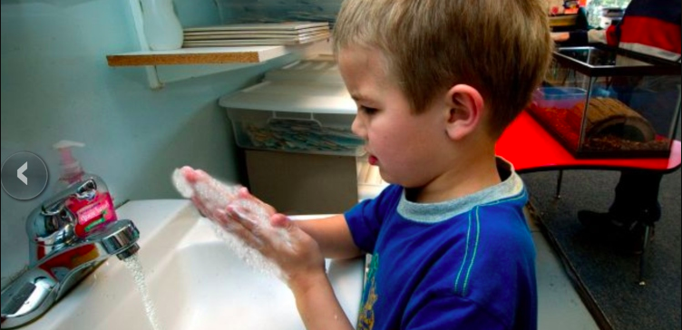 Image of child washing hands