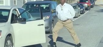 Image of man dancing in traffic jam