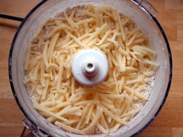 Image of shredded cheese in food processor