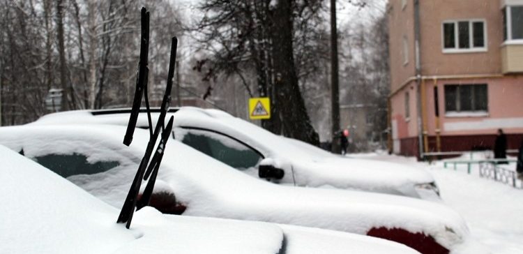 Image of cars with wipers up.