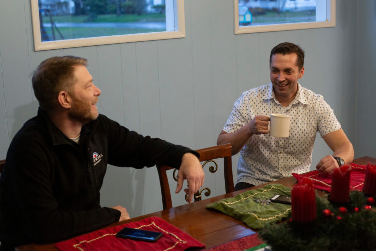 Vince Villano, left, and Justin McNeil share a laugh at the McNeil home in DuPont, WA on December 11, 2018. Villano befriended his Starbucks barista, Niki McNeil, and her husband, Justin, who has decided to donate his kidney to Villano, who has kidney disease. (Photo by David Ryder)