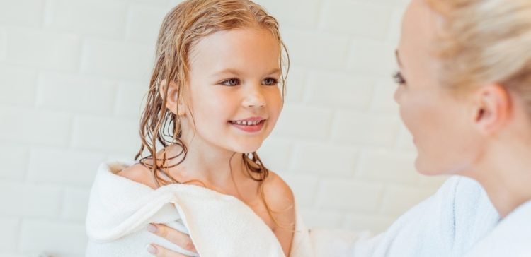 Image of girl with wet hair after bath and mom