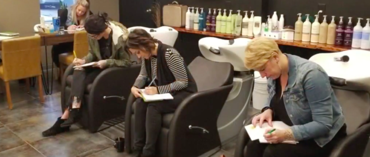 Image of hair stylists writing