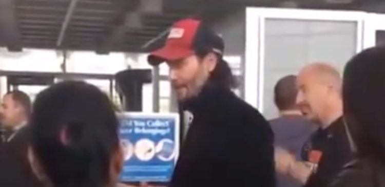 Photo of Keanu Reeves at airport.