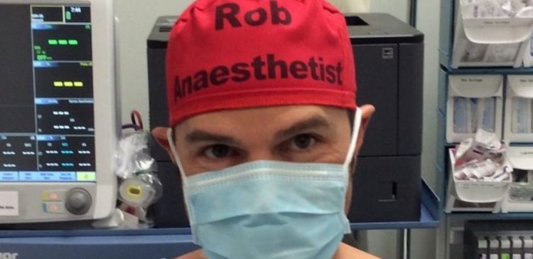 Image of Dr. Rob Hackett wearing scrub cap with name on it