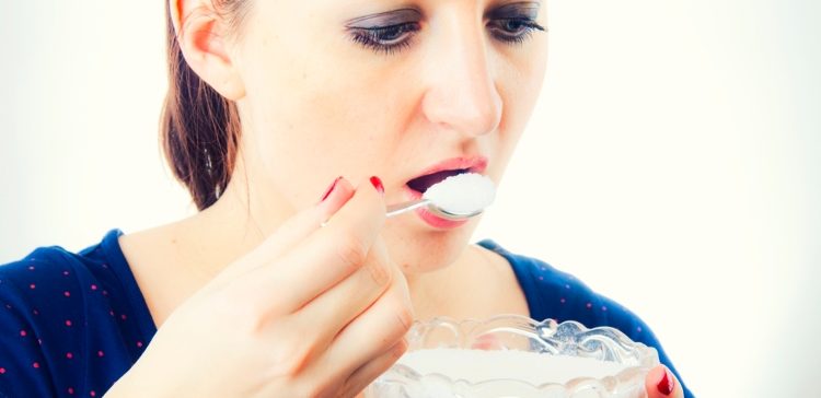 Image of woman eating sugar