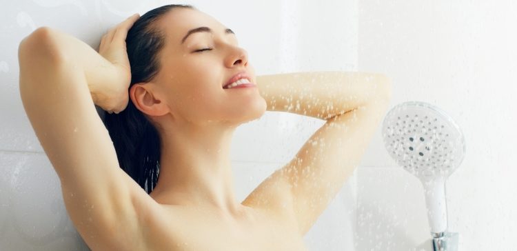 Image of a beautiful girl standing at the shower